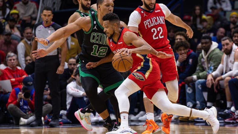 Nov 18, 2022; New Orleans, Louisiana, USA; New Orleans Pelicans guard CJ McCollum (3) dribbles against Boston Celtics forward Grant Williams (12) during the first half at Smoothie King Center. Mandatory Credit: Stephen Lew-USA TODAY Sports