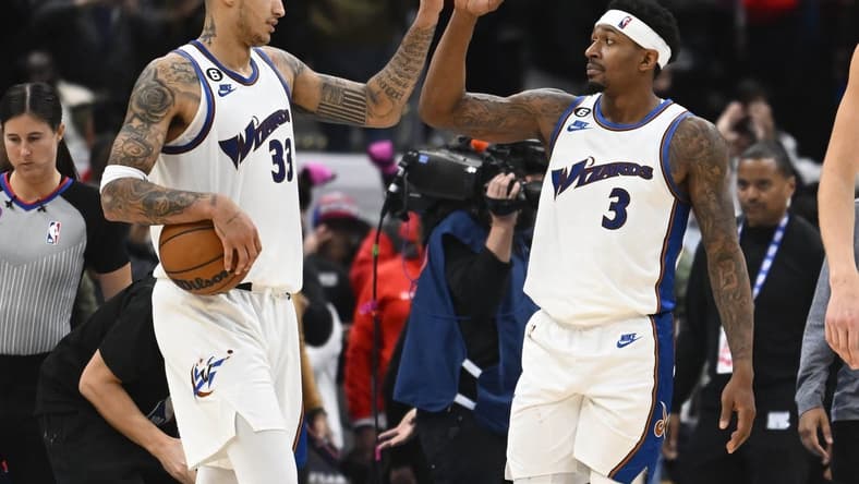 Nov 18, 2022; Washington, District of Columbia, USA; Washington Wizards guard Bradley Beal (3) and forward Kyle Kuzma (33) celebrate after the game against the Miami Heat at Capital One Arena. Mandatory Credit: Brad Mills-USA TODAY Sports