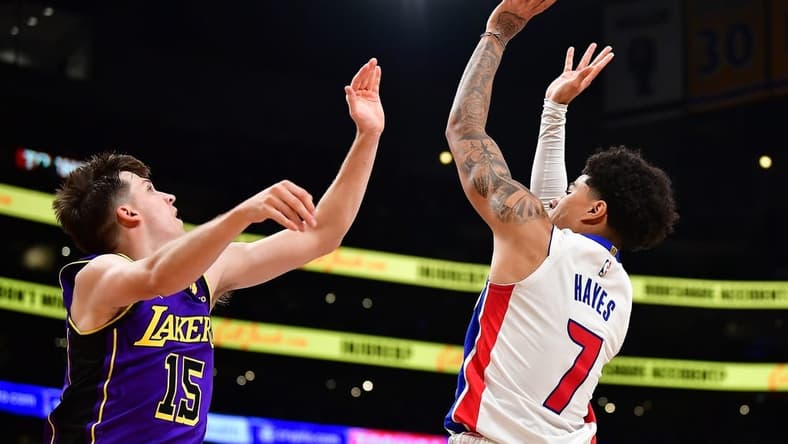 Nov 18, 2022; Los Angeles, California, USA; Detroit Pistons guard Killian Hayes (7) shoots against Los Angeles Lakers guard Austin Reaves (15) during the first half at Crypto.com Arena. Mandatory Credit: Gary A. Vasquez-USA TODAY Sports