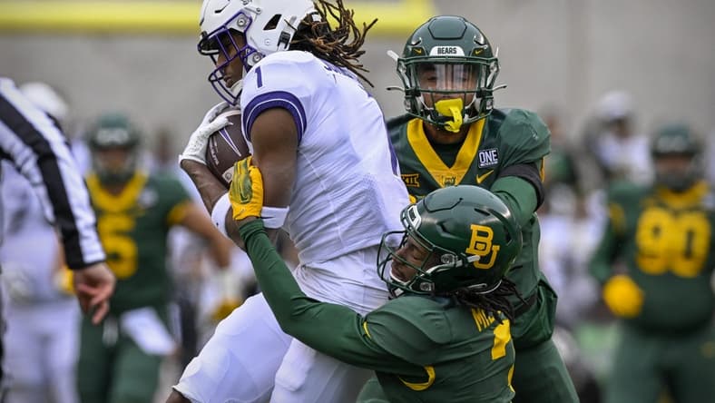 Nov 19, 2022; Waco, Texas, USA; TCU Horned Frogs wide receiver Quentin Johnston (1) catches a pass for a first down against the Baylor Bears as cornerback Mark Milton (3) defends during the first quarter at McLane Stadium. Mandatory Credit: Jerome Miron-USA TODAY Sports