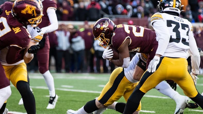 Nov 19, 2022; Minneapolis, Minnesota, USA; Minnesota Golden Gophers running back Mohamed Ibrahim (24) runs for a touchdown against the Iowa Hawkeyes during the second quarter at Huntington Bank Stadium. Mandatory Credit: Matt Krohn-USA TODAY Sports