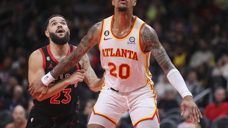 Nov 19, 2022; Atlanta, Georgia, USA; Atlanta Hawks forward John Collins (20) boxes out Toronto Raptors guard Fred VanVleet (23) in the second quarter at State Farm Arena. Mandatory Credit: Brett Davis-USA TODAY Sports