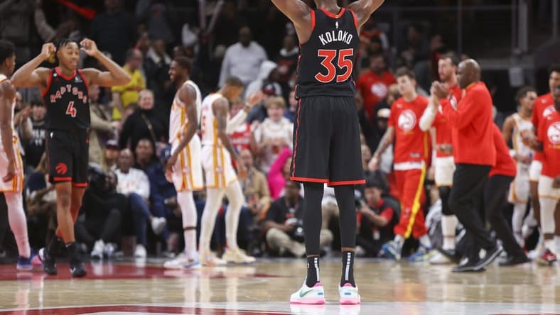 Nov 19, 2022; Atlanta, Georgia, USA; Toronto Raptors forward Christian Koloko (35) reacts against the Atlanta Hawks in the second half at State Farm Arena. Mandatory Credit: Brett Davis-USA TODAY Sports