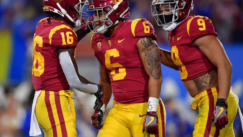 Nov 19, 2022; Pasadena, California, USA; Southern California Trojans running back Austin Jones (6) celebrates his touchdown scored against the UCLA Bruins with wide receiver Tahj Washington (16) and wide receiver Michael Jackson III (9) during the first half at the Rose Bowl. Mandatory Credit: Gary A. Vasquez-USA TODAY Sports