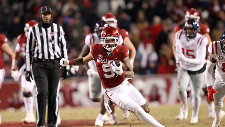 Nov 19, 2022; Fayetteville, Arkansas, USA; Arkansas Razorbacks wide receiver Jadon Haselwood (9) runs after a catch in the second quarter against the Ole Miss Rebels at Donald W. Reynolds Razorback Stadium. Mandatory Credit: Nelson Chenault-USA TODAY Sports