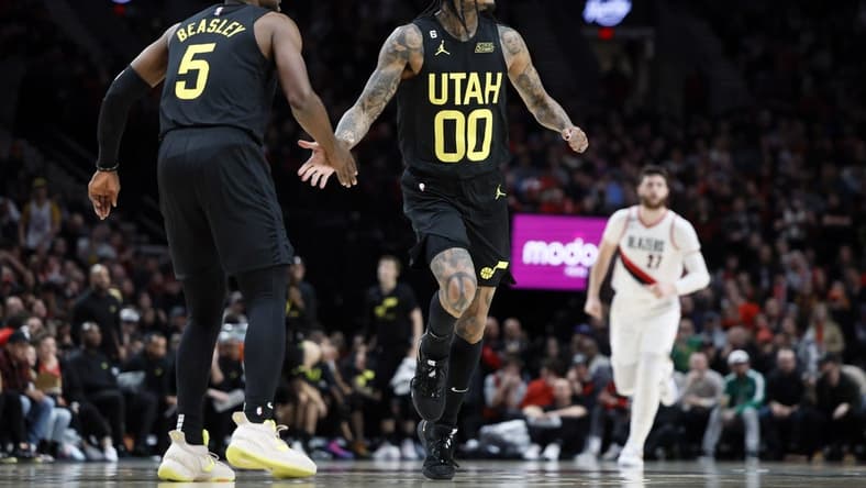 Nov 19, 2022; Portland, Oregon, USA; Utah Jazz point guard Jordan Clarkson (00) celebrates a basket with teammate Malik Beasley (5) during the second half against the Portland Trail Blazers at Moda Center. Mandatory Credit: Soobum Im-USA TODAY Sports