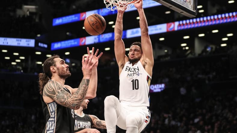 Nov 20, 2022; Brooklyn, New York, USA; Brooklyn Nets guard Ben Simmons (10) dunks on Memphis Grizzlies center Steven Adams (4) in the third quarter at Barclays Center. Mandatory Credit: Wendell Cruz-USA TODAY Sports
