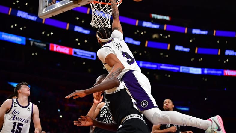Nov 20, 2022; Los Angeles, California, USA; Los Angeles Lakers forward Anthony Davis (3) is fouled by San Antonio Spurs center Gorgui Dieng (41) during the second half at Crypto.com Arena. Mandatory Credit: Gary A. Vasquez-USA TODAY Sports