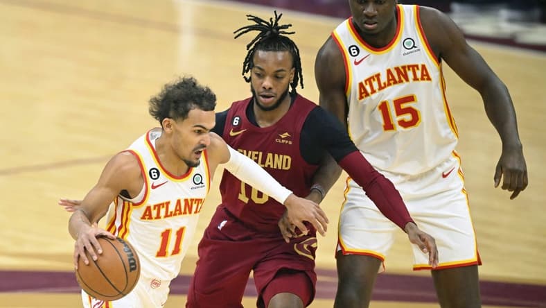 Nov 21, 2022; Cleveland, Ohio, USA; Cleveland Cavaliers guard Darius Garland (10) tries to get between Atlanta Hawks guard Trae Young (11) and center Clint Capela (15) in the first quarter at Rocket Mortgage FieldHouse. Mandatory Credit: David Richard-USA TODAY Sports