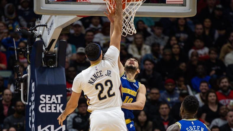 Nov 21, 2022; New Orleans, Louisiana, USA; New Orleans Pelicans forward Larry Nance Jr. (22) dunks the ball against Golden State Warriors guard Ty Jerome (10) during the first half at Smoothie King Center. Mandatory Credit: Stephen Lew-USA TODAY Sports
