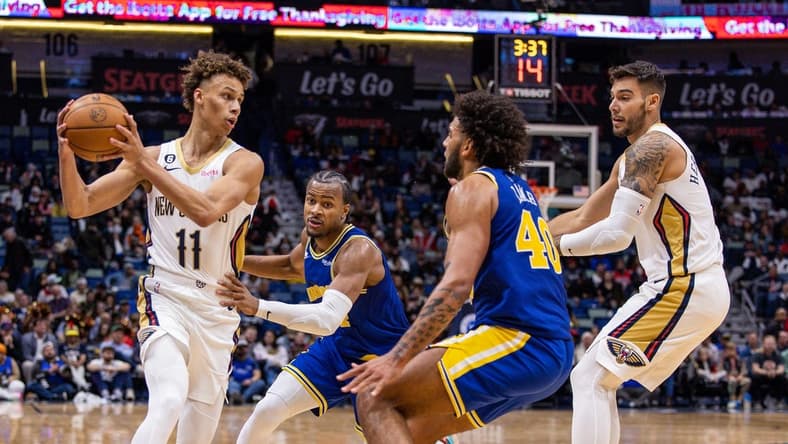 Nov 21, 2022; New Orleans, Louisiana, USA; New Orleans Pelicans guard Dyson Daniels (11) looks to pass the ball against Golden State Warriors forward Anthony Lamb (40) during the second half at Smoothie King Center. Mandatory Credit: Stephen Lew-USA TODAY Sports