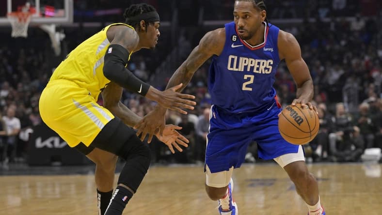 Nov 21, 2022; Los Angeles, California, USA; Los Angeles Clippers forward Kawhi Leonard (2) is defended by Utah Jazz forward Jarred Vanderbilt (8) in the first half at Crypto.com Arena. Mandatory Credit: Jayne Kamin-Oncea-USA TODAY Sports