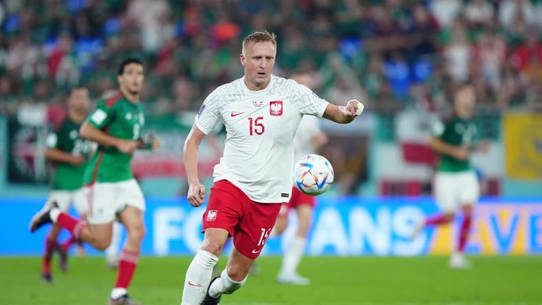 Nov 22, 2022; Doha, Qatar; Poland defender Kamil Glik (15) moves the ball during the second half against Mexico in a group stage match at the 2022 World Cup at Stadium 974. Mandatory Credit: Danielle Parhizkaran-USA TODAY Sports