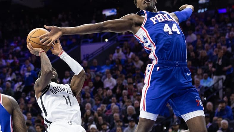 Nov 22, 2022; Philadelphia, Pennsylvania, USA; Philadelphia 76ers forward Paul Reed (44) reaches to block the shot attempt of Brooklyn Nets guard Kyrie Irving (11) during the second quarter at Wells Fargo Center. Mandatory Credit: Bill Streicher-USA TODAY Sports