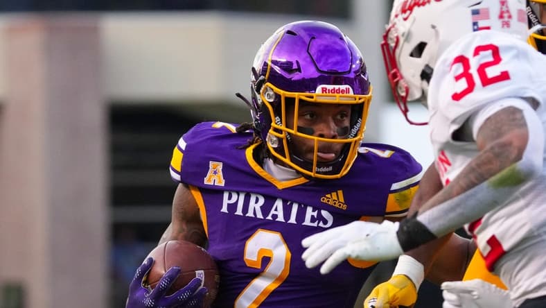 Nov 19, 2022; Greenville, North Carolina, USA; East Carolina Pirates running back Keaton Mitchell (2) runs with the ball against the Houston Cougars during the first half at Dowdy-Ficklen Stadium. Mandatory Credit: James Guillory-USA TODAY Sports