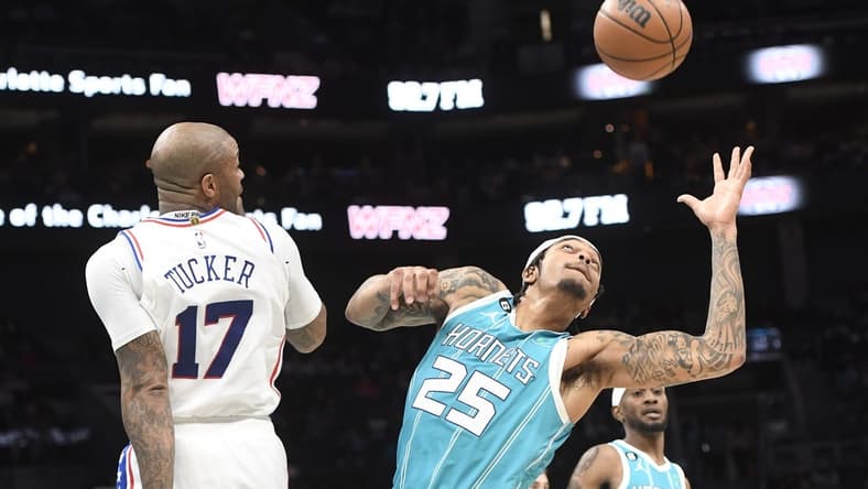 Nov 23, 2022; Charlotte, North Carolina, USA; Charlotte Hornets forward P.J. Washington (25) gets a rebound during the first half against the Philadelphia 76ers at the Spectrum Center. Mandatory Credit: Sam Sharpe-USA TODAY Sports
