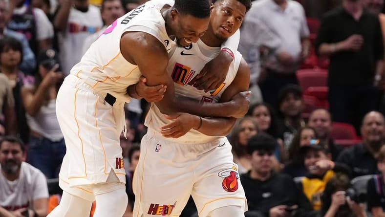Nov 23, 2022; Miami, Florida, USA; Miami Heat center Bam Adebayo (13) hugs guard Kyle Lowry (7) after defeating the Washington Wizards at FTX Arena. Mandatory Credit: Jasen Vinlove-USA TODAY Sports