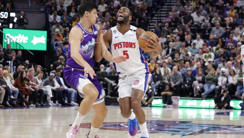 Nov 23, 2022; Salt Lake City, Utah, USA; Detroit Pistons guard Alec Burks (5) is fouled by Utah Jazz forward Simone Fontecchio (16) during the second quarter at Vivint Arena. Mandatory Credit: Chris Nicoll-USA TODAY Sports