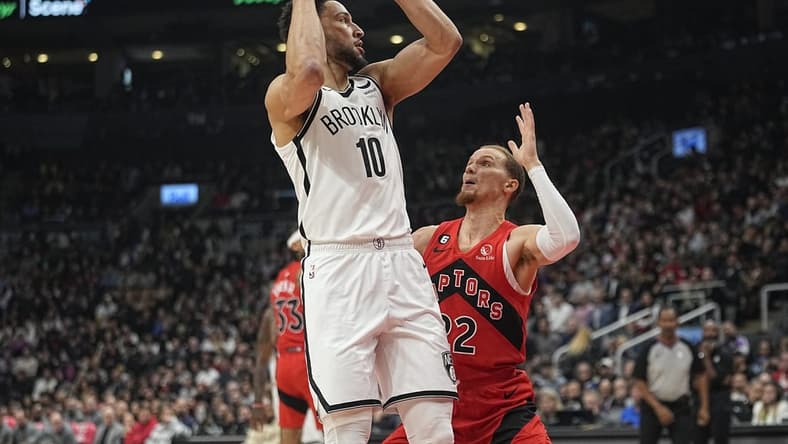 Nov 23, 2022; Toronto, Ontario, CAN; Brooklyn Nets guard Ben Simmons (10) goes to pass the ball as Toronto Raptors guard Malachi Flynn (22) defends during the first quarter at Scotiabank Arena. Mandatory Credit: John E. Sokolowski-USA TODAY Sports