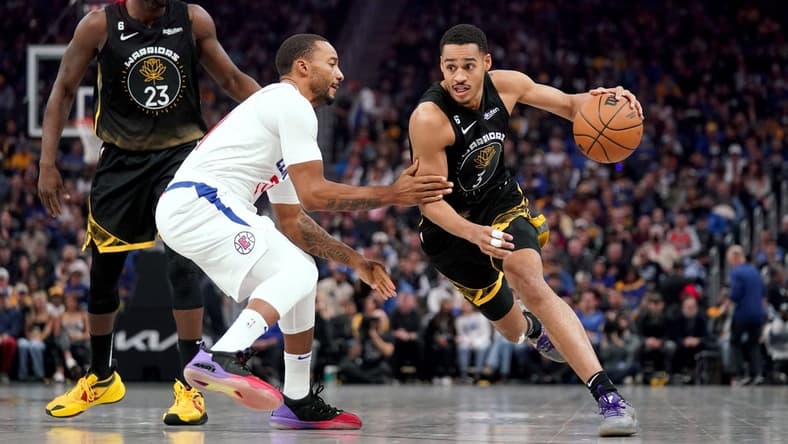 Nov 23, 2022; San Francisco, California, USA; Golden State Warriors guard Jordan Poole (3) dribbles past Los Angeles Clippers guard Norman Powell (24) in the first quarter at the Chase Center. Mandatory Credit: Cary Edmondson-USA TODAY Sports