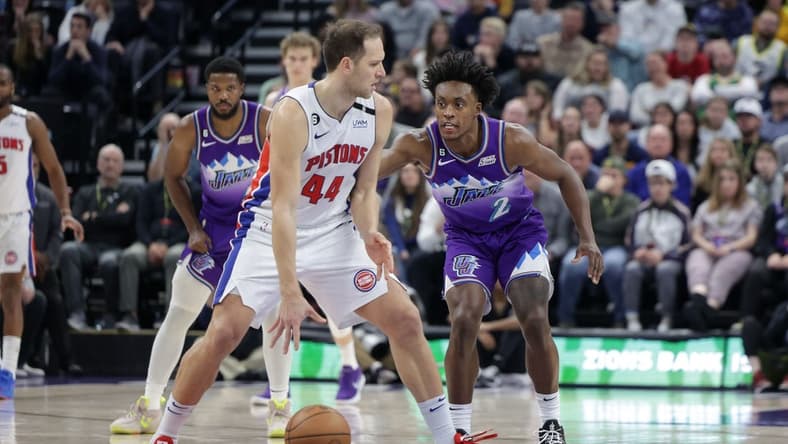 Nov 23, 2022; Salt Lake City, Utah, USA; Detroit Pistons forward Bojan Bogdanovic (44) keeps the ball away from Utah Jazz guard Collin Sexton (2) during the second half at Vivint Arena. Mandatory Credit: Chris Nicoll-USA TODAY Sports