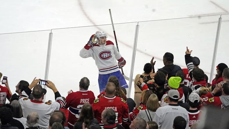 Nov 25, 2022; Chicago, Illinois, USA; Montreal Canadiens center Kirby Dach (77) celebrates the game winning goal against the Chicago Blackhawks during a shootout at United Center. Mandatory Credit: David Banks-USA TODAY Sports