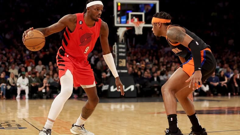 Nov 25, 2022; New York, New York, USA; Portland Trail Blazers forward Jerami Grant (9) controls the ball against New York Knicks guard Miles McBride (2) during the first quarter at Madison Square Garden. Mandatory Credit: Brad Penner-USA TODAY Sports