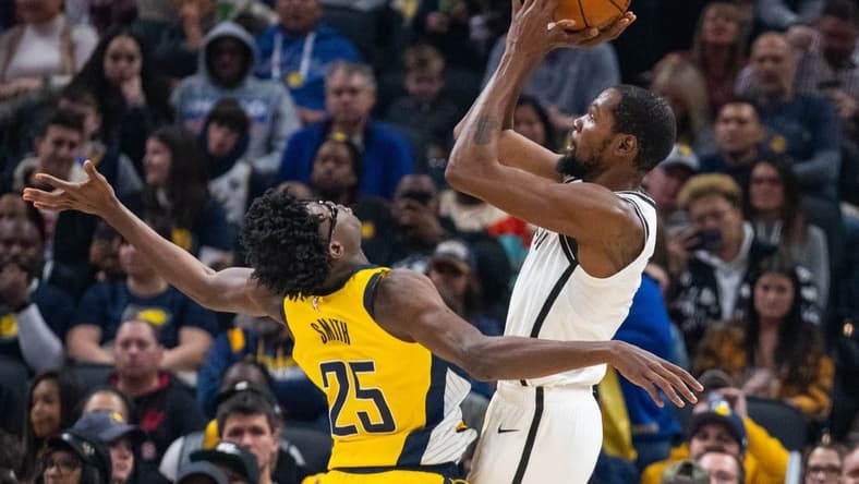 Nov 25, 2022; Indianapolis, Indiana, USA; Brooklyn Nets forward Kevin Durant (7) shoots the ball while Indiana Pacers forward Jalen Smith (25) defends in the second quarter at Gainbridge Fieldhouse. Mandatory Credit: Trevor Ruszkowski-USA TODAY Sports