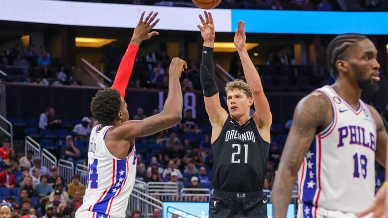 Nov 25, 2022; Orlando, Florida, USA; Orlando Magic center Moritz Wagner (21) shoots the ball over Philadelphia 76ers forward Paul Reed (44) during the second half at Amway Center. Mandatory Credit: Mike Watters-USA TODAY Sports