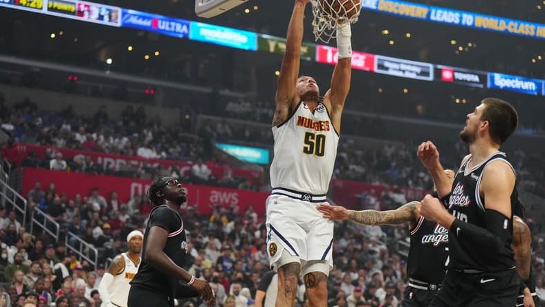 Nov 25, 2022; Los Angeles, California, USA; Denver Nuggets forward Aaron Gordon (50) dunks the ball against LA Clippers guard Reggie Jackson (1) and center Ivica Zubac (40) in the first half at Crypto.com Arena. Mandatory Credit: Kirby Lee-USA TODAY Sports
