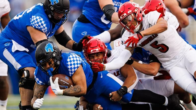 Nov 26, 2022; Lexington, Kentucky, USA; Kentucky Wildcats running back Chris Rodriguez Jr. (24) falls forward on a run during the first quarter against the Louisville Cardinals at Kroger Field. Mandatory Credit: Jordan Prather-USA TODAY Sports