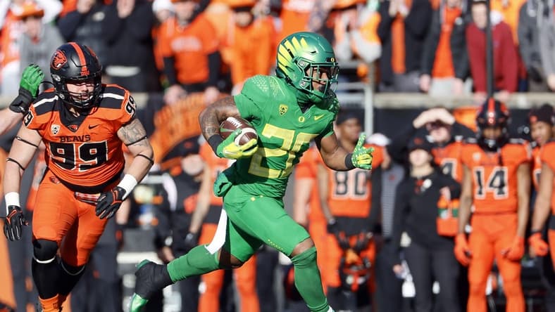 Nov 26, 2022; Corvallis, Oregon, USA; Oregon Ducks running back Jordan James (20) runs with the ball during the first half against the Oregon State Beavers at Reser Stadium. Mandatory Credit: Soobum Im-USA TODAY Sports