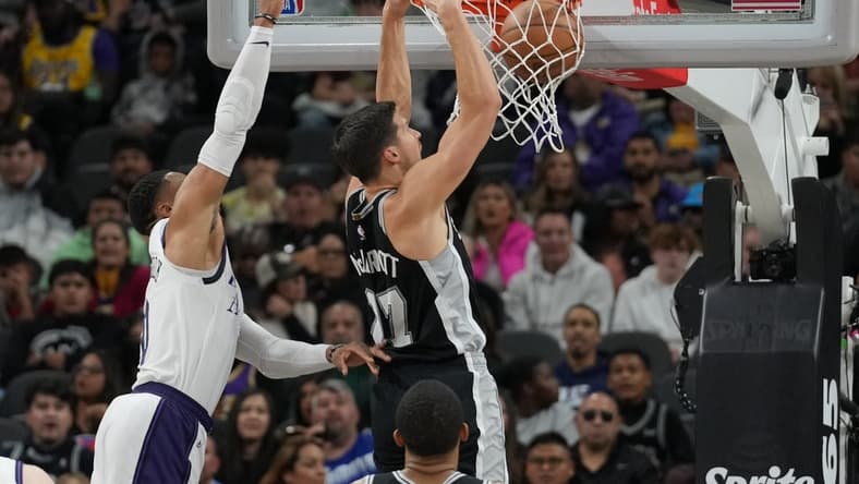 Nov 26, 2022; San Antonio, Texas, USA; San Antonio Spurs forward Doug McDermott (17) dunks in the first half against the Los Angeles Lakers at the AT&T Center. Mandatory Credit: Daniel Dunn-USA TODAY Sports