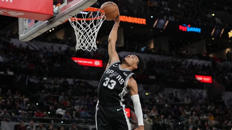Nov 26, 2022; San Antonio, Texas, USA; San Antonio Spurs guard Tre Jones (33) goes up for a dunk in the second half against the Los Angeles Lakers at the AT&T Center. Mandatory Credit: Daniel Dunn-USA TODAY Sports