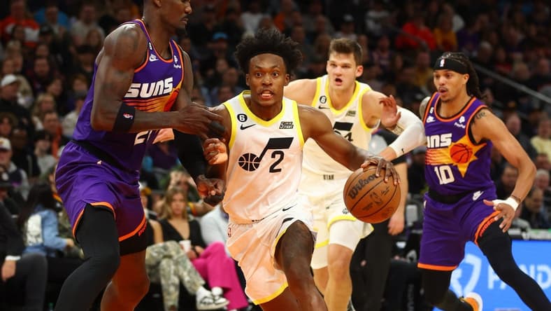 Nov 26, 2022; Phoenix, Arizona, USA; Utah Jazz guard Collin Sexton (2) drives to the basket against Phoenix Suns center Deandre Ayton (22) in the first half at Footprint Center. Mandatory Credit: Mark J. Rebilas-USA TODAY Sports