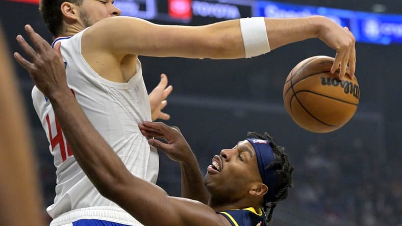Nov 27, 2022; Los Angeles, California, USA; Los Angeles Clippers center Ivica Zubac (40) blocks a shot by Indiana Pacers guard Buddy Hield (24) in the first half at Crypto.com Arena. Mandatory Credit: Jayne Kamin-Oncea-USA TODAY Sports