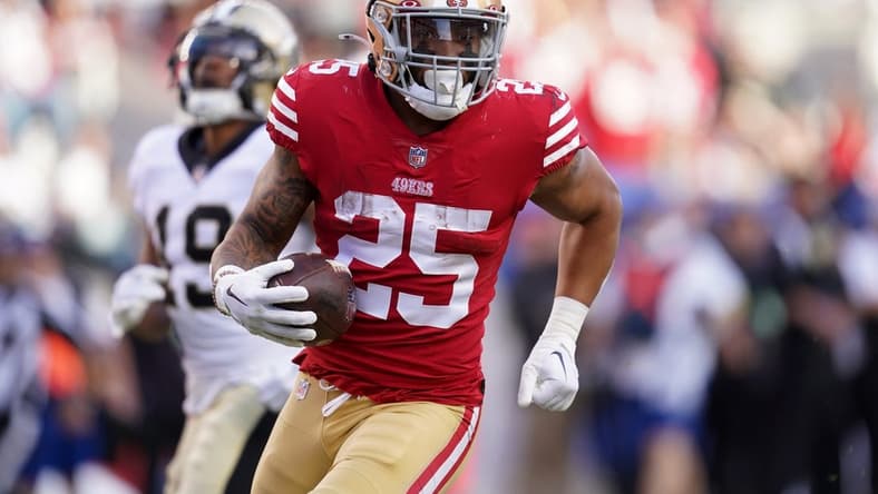 Nov 27, 2022; Santa Clara, California, USA; San Francisco 49ers running back Elijah Mitchell (25) runs the ball against the New Orleans Saints in the second quarter at Levi's Stadium. Mandatory Credit: Cary Edmondson-USA TODAY Sports