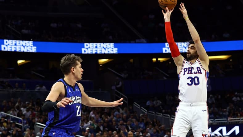 Nov 27, 2022; Orlando, Florida, USA; Philadelphia 76ers guard Furkan Korkmaz (30) shoots over Orlando Magic center Moritz Wagner (21) during the first quarter at Amway Center. Mandatory Credit: Kim Klement-USA TODAY Sports