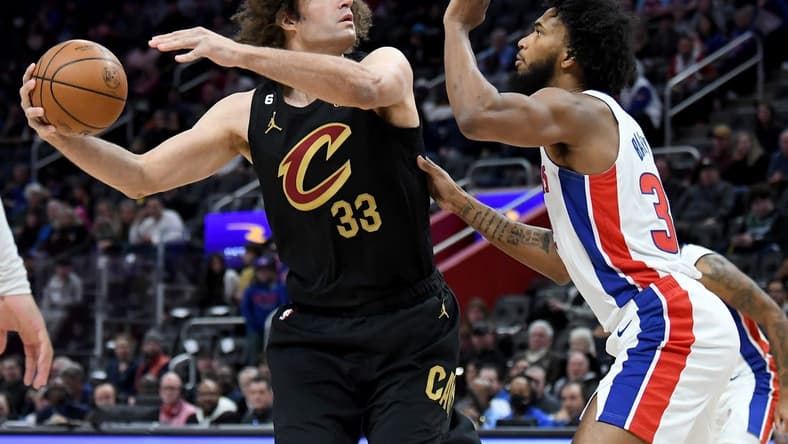 Nov 27, 2022; Detroit, Michigan, USA; Cleveland Cavaliers center Robin Lopez (33) shoots against Detroit Pistons center Marvin Bagley III (33) in the first quarter at Little Caesars Arena. Mandatory Credit: Lon Horwedel-USA TODAY Sports