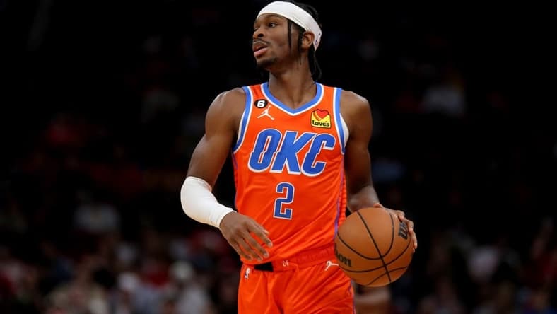 Nov 26, 2022; Houston, Texas, USA; Oklahoma City Thunder guard Shai Gilgeous-Alexander (2) handles the ball against the Houston Rockets during the game at Toyota Center. Mandatory Credit: Erik Williams-USA TODAY Sports