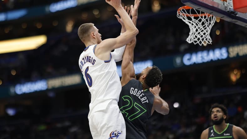 Nov 28, 2022; Washington, District of Columbia, USA; Washington Wizards center Kristaps Porzingis (6) shoots the ball over Minnesota Timberwolves center Rudy Gobert (27) in the third quarter at Capital One Arena. Mandatory Credit: Geoff Burke-USA TODAY Sports