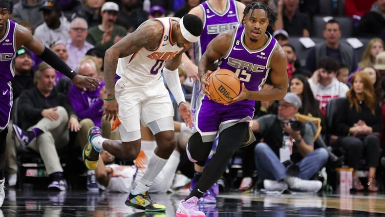 Nov 28, 2022; Sacramento, California, USA; Sacramento Kings guard Davion Mitchell (15) steals the ball during the second quarter against the Phoenix Suns at Golden 1 Center. Mandatory Credit: Sergio Estrada-USA TODAY Sports