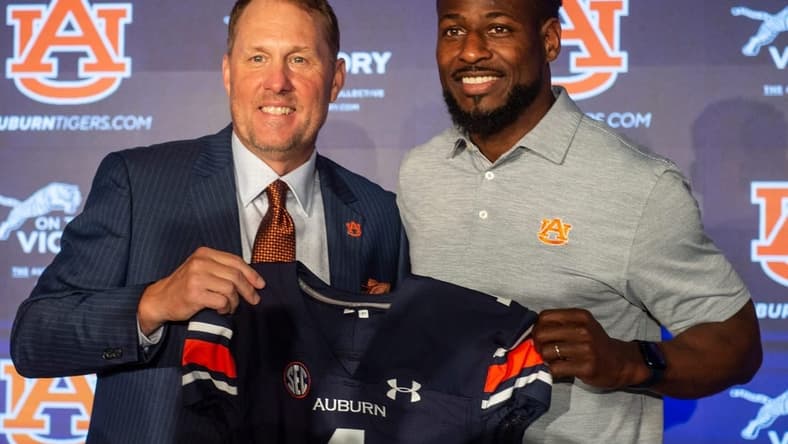 Auburn Tigers football coach Hugh Freeze poses with associate head coach Cadillac Williams at the Woltosz Football Performance Center in Auburn, Ala., on Tuesday, Nov. 29, 2022