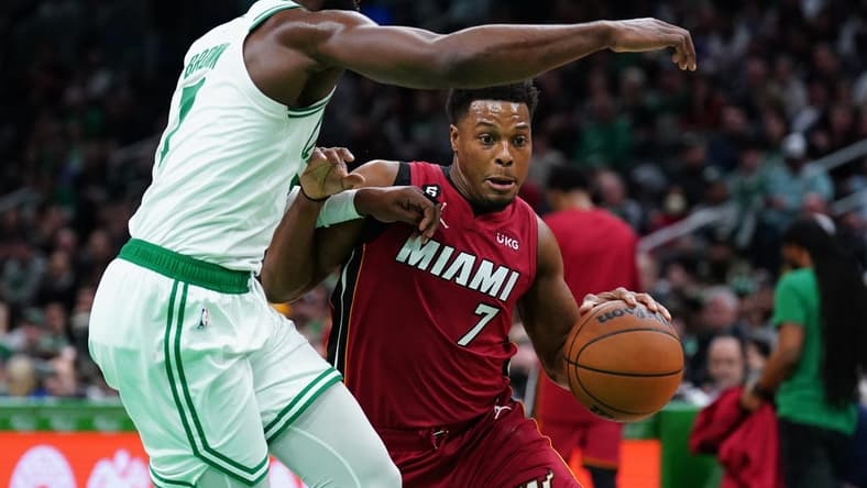 Nov 30, 2022; Boston, Massachusetts, USA; Miami Heat guard Kyle Lowry (7) drives the ball against Boston Celtics guard Jaylen Brown (7) in the first quarter at TD Garden. Mandatory Credit: David Butler II-USA TODAY Sports