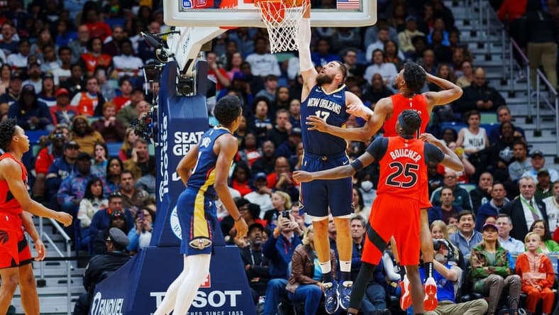 Nov 30, 2022; New Orleans, Louisiana, USA; New Orleans Pelicans center Jonas Valanciunas (17) dunks the Ball against the Toronto Raptors during the second quarter at Smoothie King Center. Mandatory Credit: Andrew Wevers-USA TODAY Sports