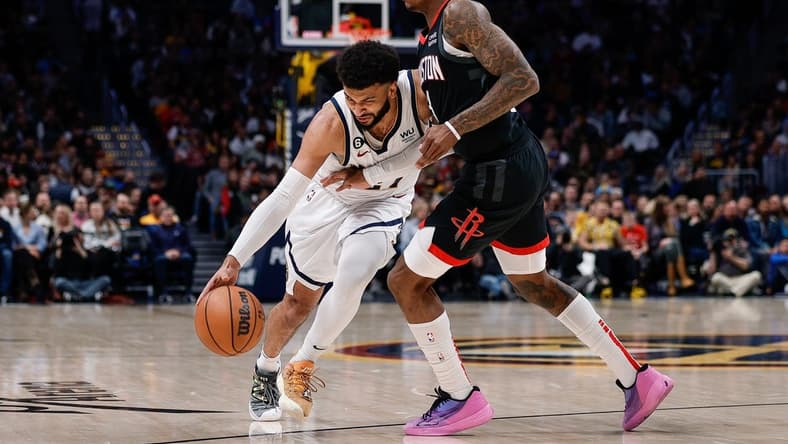 Nov 30, 2022; Denver, Colorado, USA; Denver Nuggets guard Jamal Murray (27) controls the ball under pressure from Houston Rockets guard Kevin Porter Jr. (3) in the second quarter at Ball Arena. Mandatory Credit: Isaiah J. Downing-USA TODAY Sports