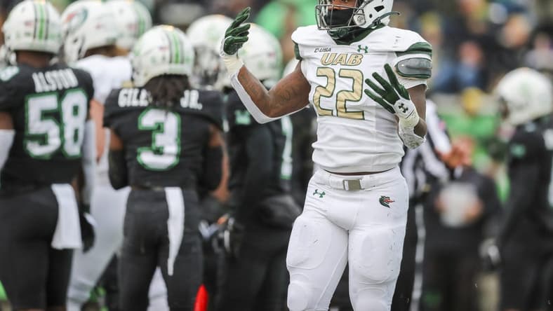 Nov 13, 2021; Huntington, West Virginia, USA; UAB Blazers running back DeWayne McBride (22) celebrates after running for a touchdown during the first quarter against the Marshall Thundering Herd at Joan C. Edwards Stadium. Mandatory Credit: Ben Queen-USA TODAY Sports