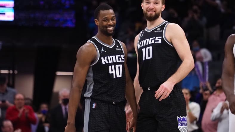 Feb 9, 2022; Sacramento, California, USA; Sacramento Kings forward Harrison Barnes (40) and center Domantas Sabonis (10) smiles in the final seconds of the game against the Minnesota Timberwolves during the fourth quarter at Golden 1 Center. Mandatory Credit: Kelley L Cox-USA TODAY Sports