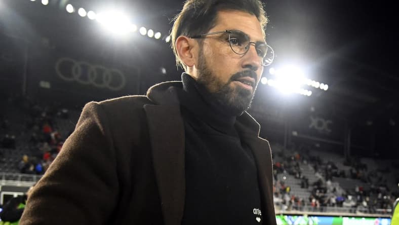 Feb 26, 2022; Washington, District of Columbia, USA; D.C. United head coach Hernan Losada leaves the field after the game against the Charlotte FC at Audi Field. Mandatory Credit: Brad Mills-USA TODAY Sports