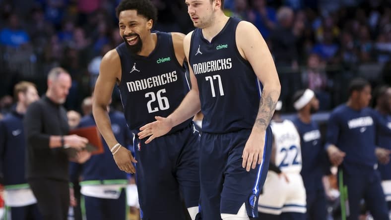 Mar 21, 2022; Dallas, Texas, USA;  Dallas Mavericks guard Luka Doncic (77) celebrates with Dallas Mavericks guard Spencer Dinwiddie (26) during the fourth quarter against the Minnesota Timberwolves at American Airlines Center. Mandatory Credit: Kevin Jairaj-USA TODAY Sports